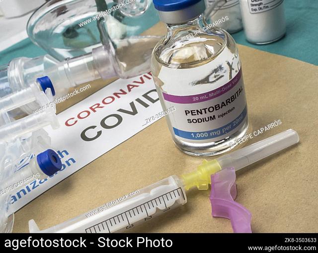 Vial of sodium pentobarbital next to an oxygen mask, covid-19 pandemic, Spain