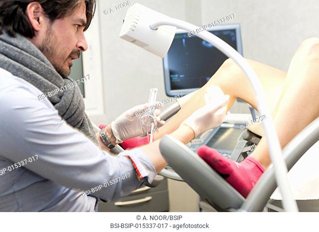 Reportage in a gynecology-obstetrics practice in Nice, France. The doctor places a single use speculum