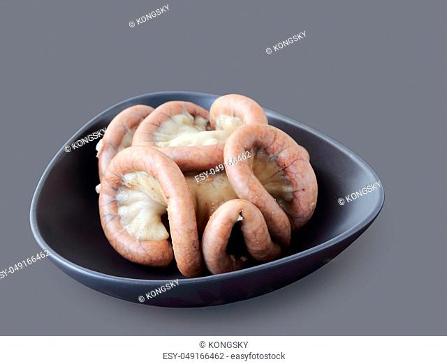 Boiled chitterlings internal organs of pig isolated on gray background, clipping path