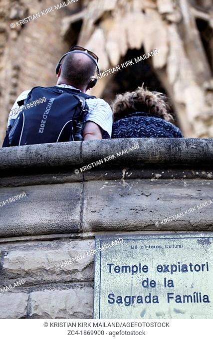 Tourist looking up La Sagrada Familia, Spain