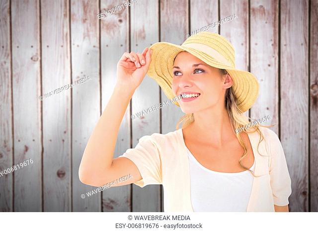 Composite image of attractive young blonde smiling in sunhat