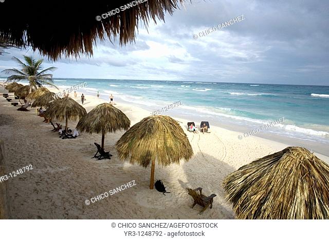 Tourists gather on a beach along the Mayan Riviera in the ancient Mayan city of Tulum in Mexico's Yucatan Peninsula