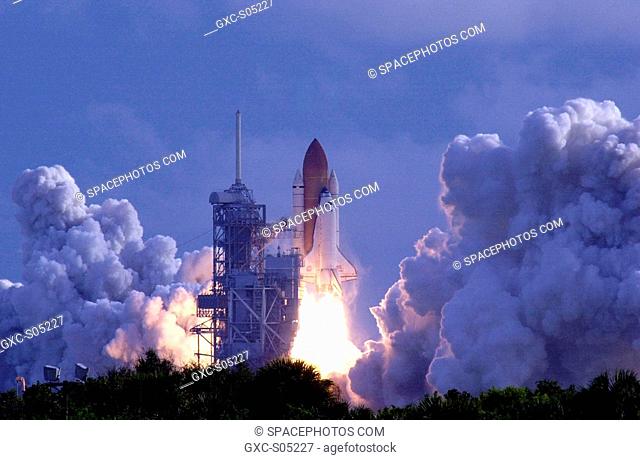 09/08/2000 -- Belching clouds of steam and smoke across the scrub lands at KSC, Space Shuttle Atlantis hurtles toward space on mission STS-106 after liftoff at...