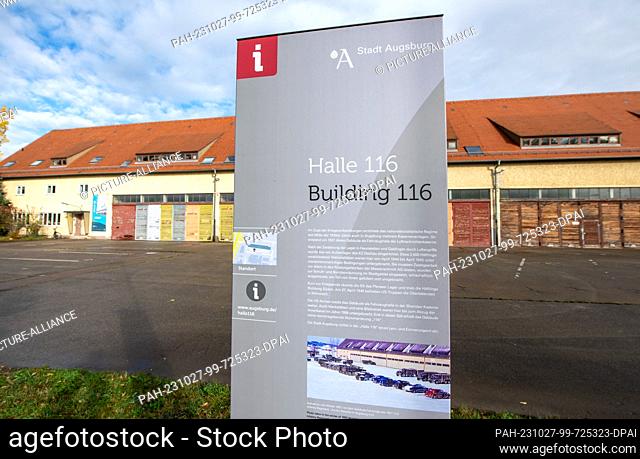 27 October 2023, Bavaria, Augsburg: In the former Sheridan Barracks, a stele in front of Hall 116 provides information about the history of the hall