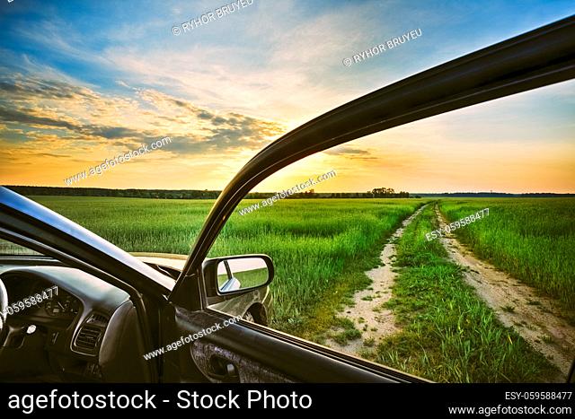 Dirty Rural Road In Summer Field, Meadow, Countryside. View From Car Window. Freedom And Dream Concept