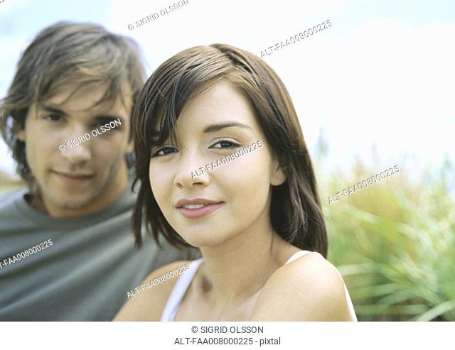 Young couple, focus on woman in foreground