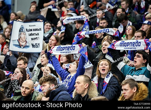 RUSSIA, MOSCOW - MARCH 6, 2023: Fans lift their Torpedo Nizhny Novgorod scarves in Leg 3 of their team's 2022/23 KHL Western Conference quarterfinal playoff tie...
