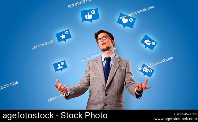 Young person playing with social media symbols