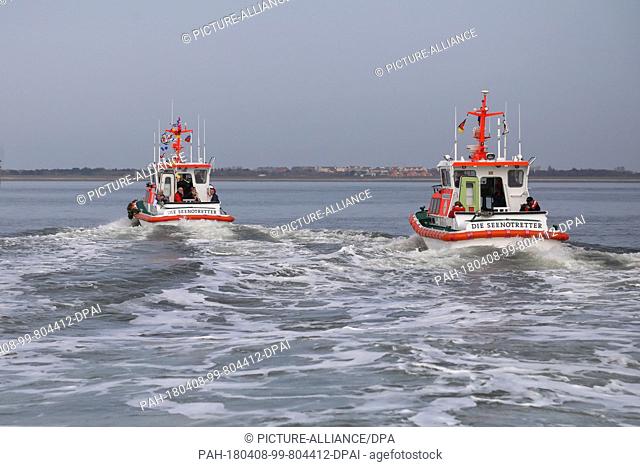 08 April 2018, Germany, Wangerooge: After the launching ceremony of the new marine rescue boat 'FRITZ THIEME' (l), special guests are taken on a tour off the...
