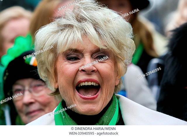 Performers take part in the annual St. Patrick's Day Parade in central London, as tens of thousands of people watch the parade