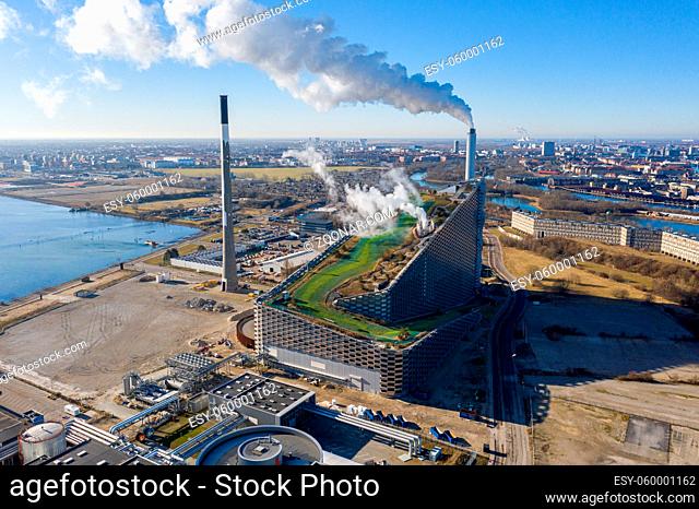 Copenhagen, Denmark - March 05, 2021: Aerial drone view of Amager Bakke, a waste to power plant with a ski slope on top