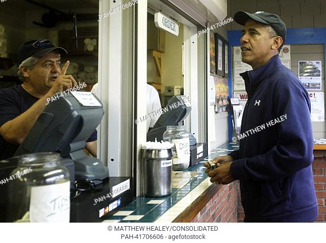 United States President Barack Obama (R) places an order at Nancy's Restaurant in Oak Bluffs, Massachusetts on the island of Martha's Vineyard on August 13