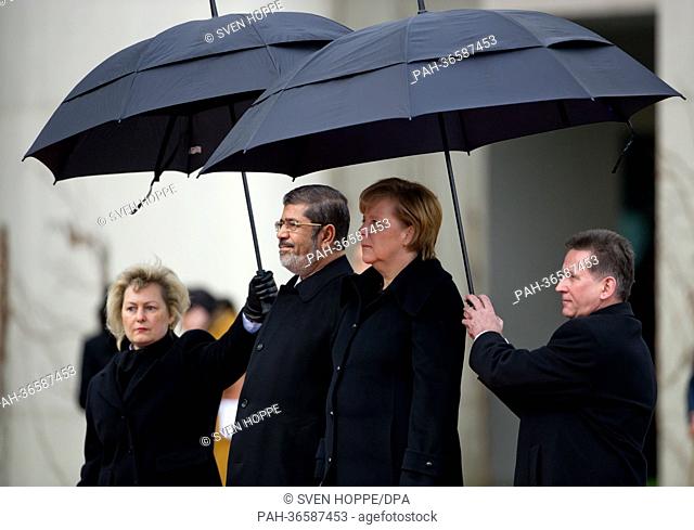 German Chancellor Angela Merkel (CDU, 2nd R) receives Egyptian President Mohammed Mursi (2nd L) in Berlin, Germany, 30 January 2013