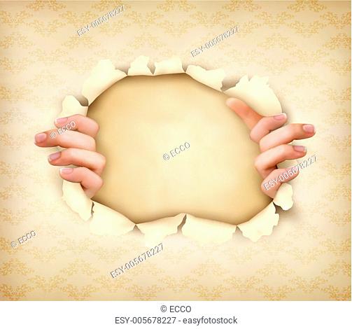 Vintage background with hands showing trough a hole of in old pa