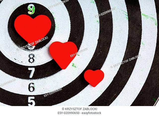 Closeup black white target with hearts bullseye as love background