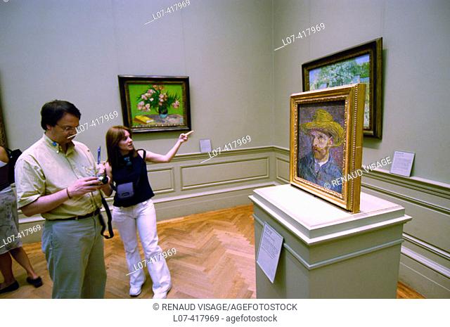 Tourists looking at Van Gogh paintings. Metropolitan Museum of Art. New York City. New York. United States