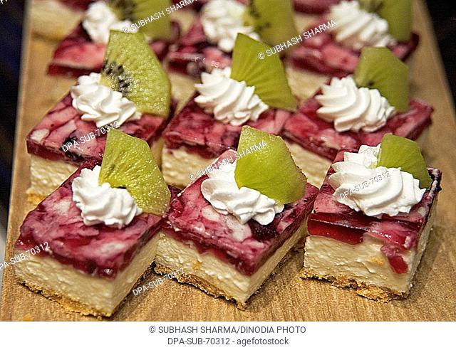Snacks , Raspberry gateau with cream and white chocolate curls food dessert cake