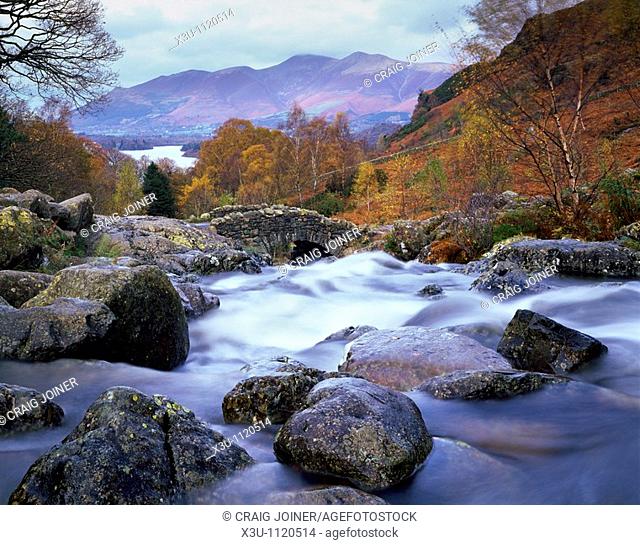 Ashness Bridge near Keswick in the Lake District National Park, Cumbria, England, United Kingdom  Dewent Water and Skiddaw can be seen in the distance