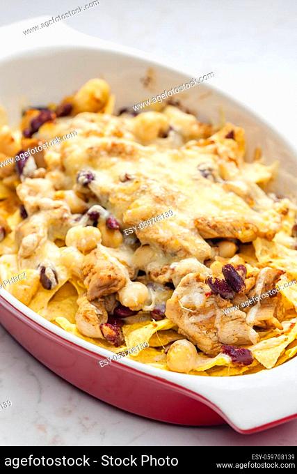 nachos with chicken meat, red beans and cheese