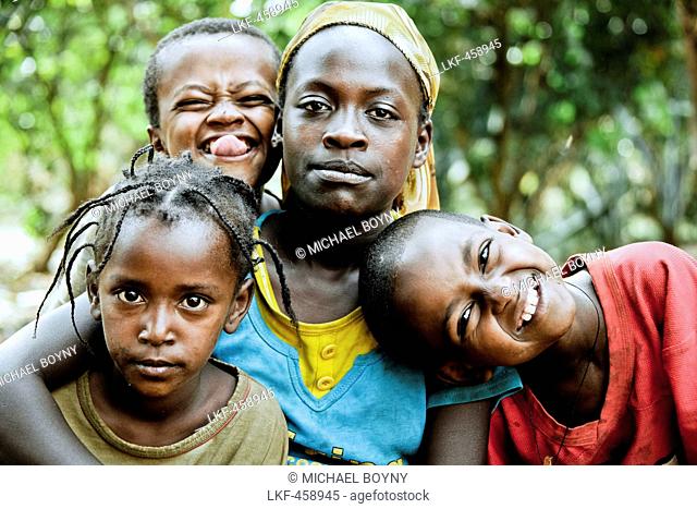 Three children and a young woman from the Ari tribe, Jinka, South Ethiopia, Africa