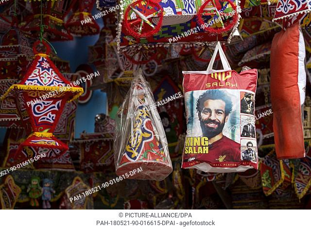 A picture made available on 21 May shows a shopping bag bearing the image of Liverpool's Egyptian star Mohamed Salah, on display for sell at a street market in...