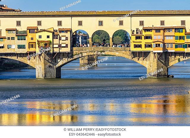 Ponte Vecchio Bridge Reflections Arno River Florence Tuscany Italy. Bridge originally built in Roman times, rebuilt in 1345