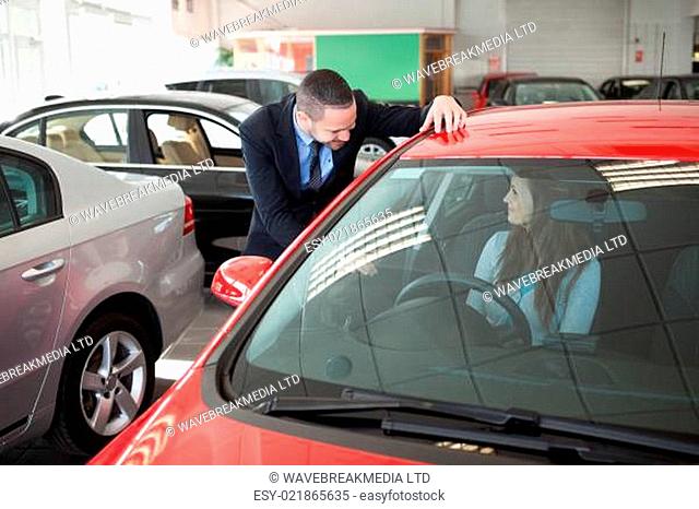 Woman trying a new car in a dealership