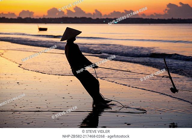 Vietnam, Mui Ne, Mui Ne Beach, Net Fisherwoman at Dawn