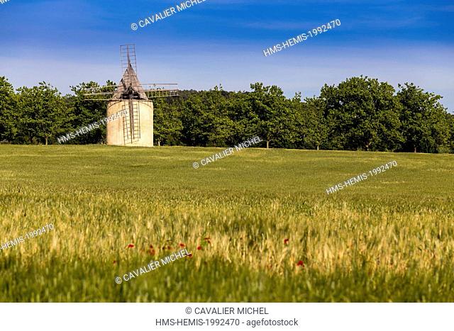 France, Vaucluse, regional natural reserve of Luberon, Sannes, windmill near a wheatfield