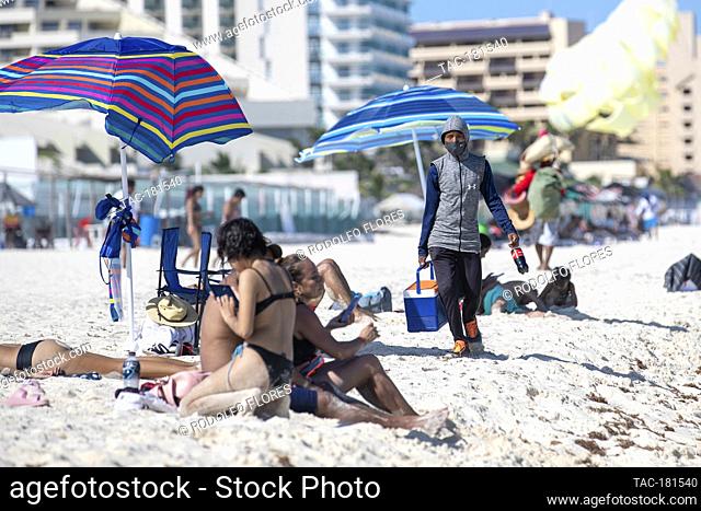 CANCUN, MEXICO - SEPTEMBER 29: A seller offers food for tourists while they enjoy holidays after 5 months for coronavirus lockdown