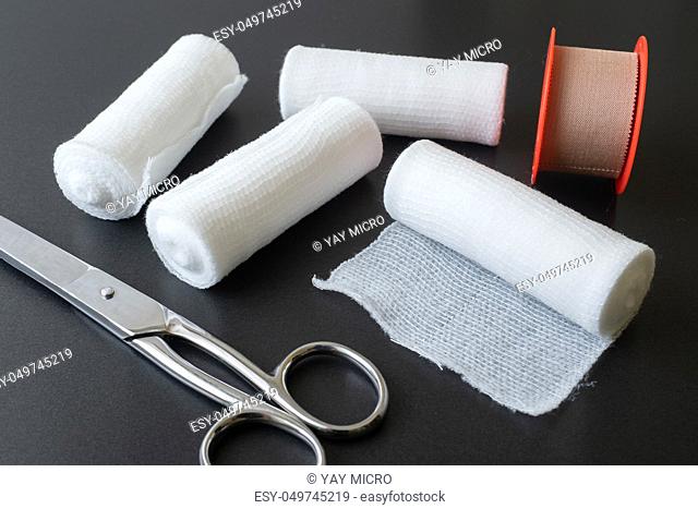 Medical bandages with scissors and sticking plaster. Medical equipment