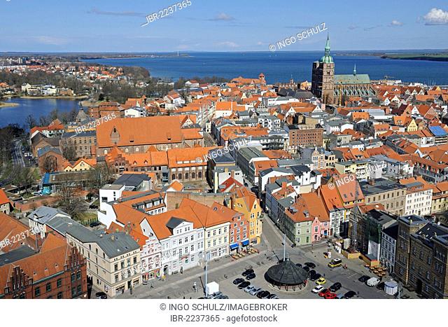 View from the tower of St. Mary's Church, Marienkirche, overlooking the old town with St. Nicholas Church, Nikolaikirche, harbour and Strelasund Sound