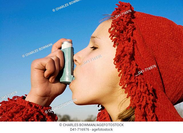 girl child asthma mixed race in red hood photograph inhaler