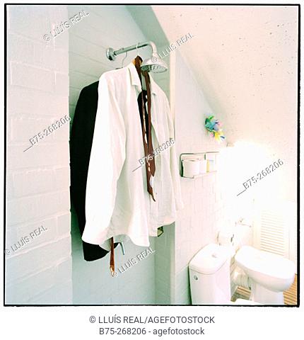 Clothes hanged in the shower head