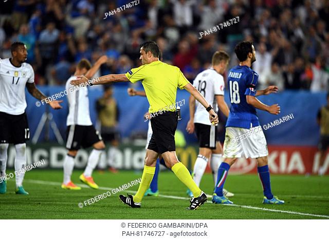 Referee Viktor Kassai gestures during the UEFA EURO 2016 quarter final soccer match between Germany and Italy at the Stade de Bordeaux in Bordeaux, France