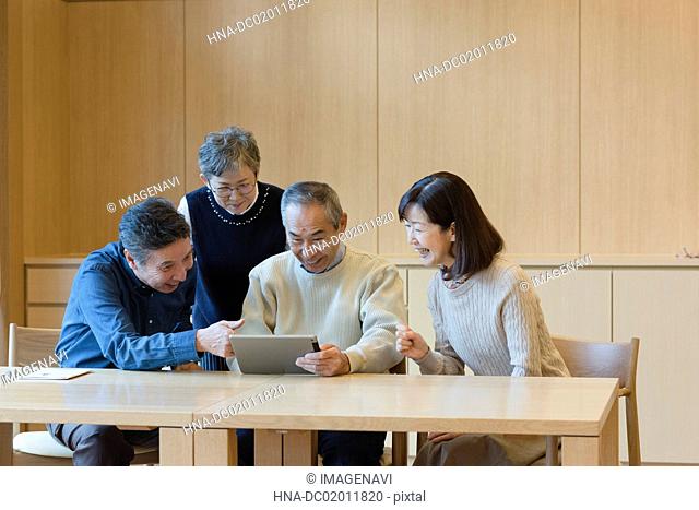 Senior people excited with tablet