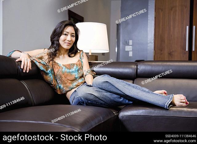 Korean woman relaxing on sofa