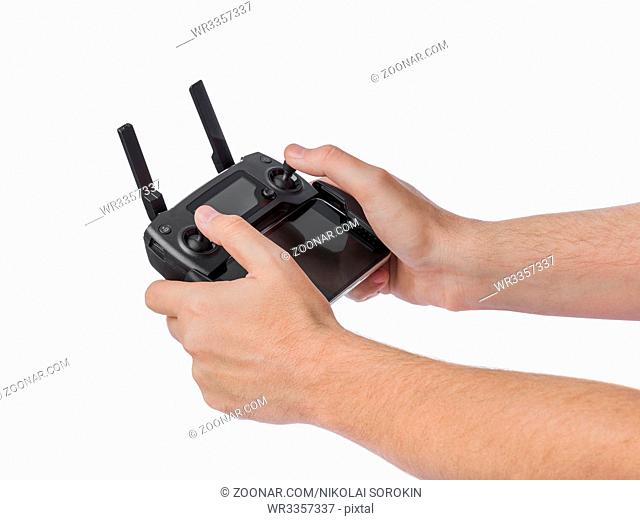 Radio remote control in hands - isolated on white background