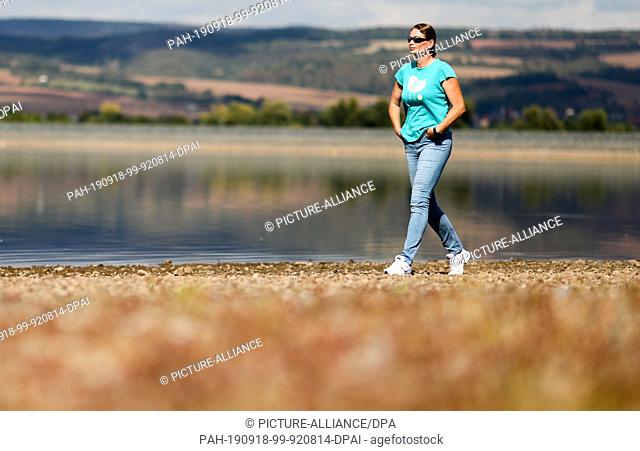 12 September 2019, Saxony-Anhalt, Kelbra: Former shot-putter Nadine Kleinert walks along the Kelbra reservoir. Lack of attractiveness for teenagers