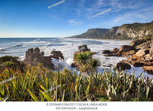 The incoming tide pounding on the rocky shoreline at Punakaiki, in the Paparoa National Park on the West Coast of the South Island, New Zealand