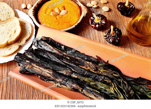 barbecued calcots, sweet onions, and romesco sauce typical of Ca