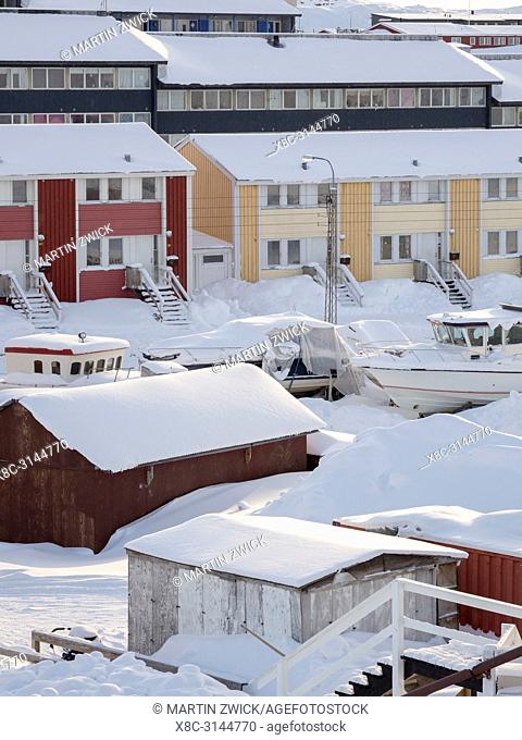 Modern living quarters. Town Ilulissat at the shore of Disko Bay in West Greenland, center for tourism, administration and economy