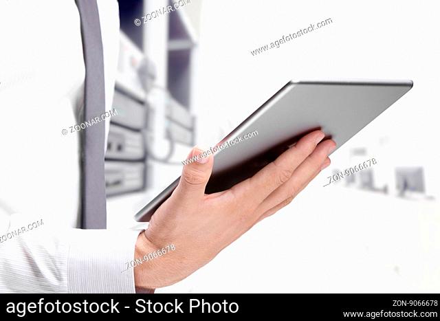 double exposure of businessman with tablet on building background