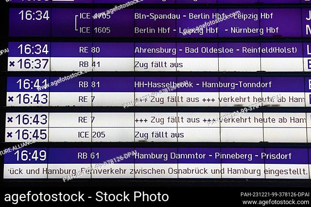 21 December 2023, Hamburg: Train cancellations are shown on a display board at the main station. Storm ""Zoltan"" is causing cancellations and delays to...