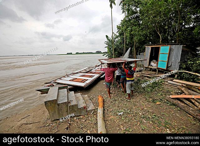The residents that established on the shore of the Munshiganj river are seen moving to other areas on August 23rd 2021 in Dhaka, Bangladesh