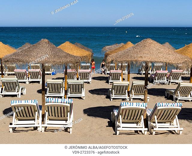Straw umbrellas & Hammock, beach, Fuengirola. Malaga province Costa del Sol. Andalusia southern, Spain Europe