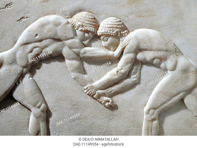 Greek civilization, 6th century b.C. Stele representing a wrestling competition. Detail: wrestlers (kouros). Relief from the Kerameikos necropolis, 510 b