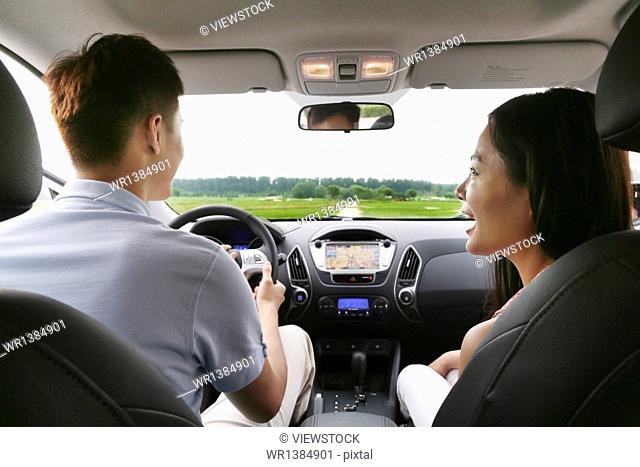 Young couple driving trips