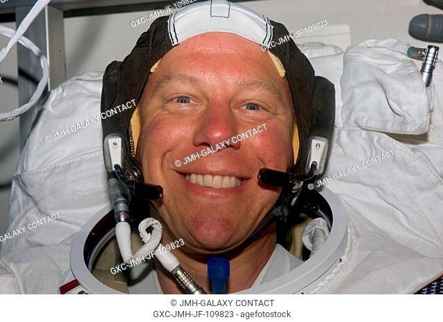 Astronaut Tim Kopra, STS-127 mission specialist converting to Expedition 20 flight engineer, is all smiles prior to donning his helmet and performing the final...