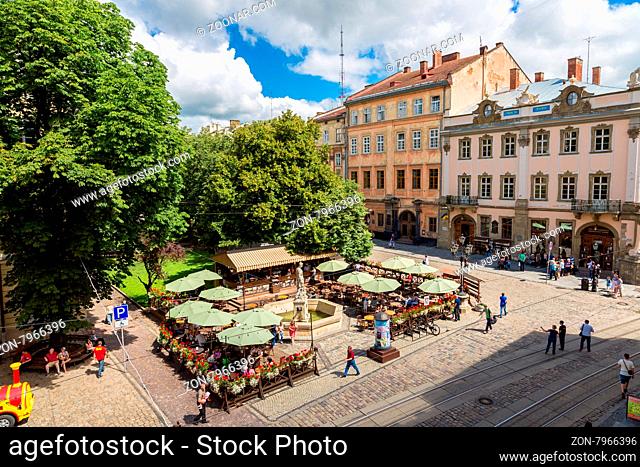 LVOV, UKRAINE - MAY 11: Market square - historical and tourist centre of the town on May 11, 2014 in Lvov, Ukraine. Historical centre of Lvov is UNESCO World...